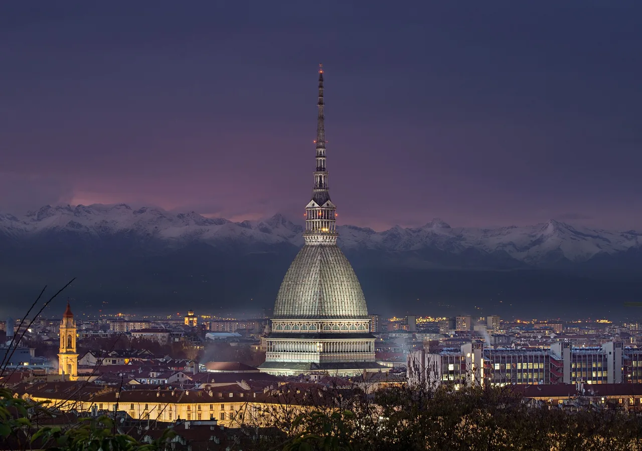 The Mole Antonelliana and the Alps at dusk